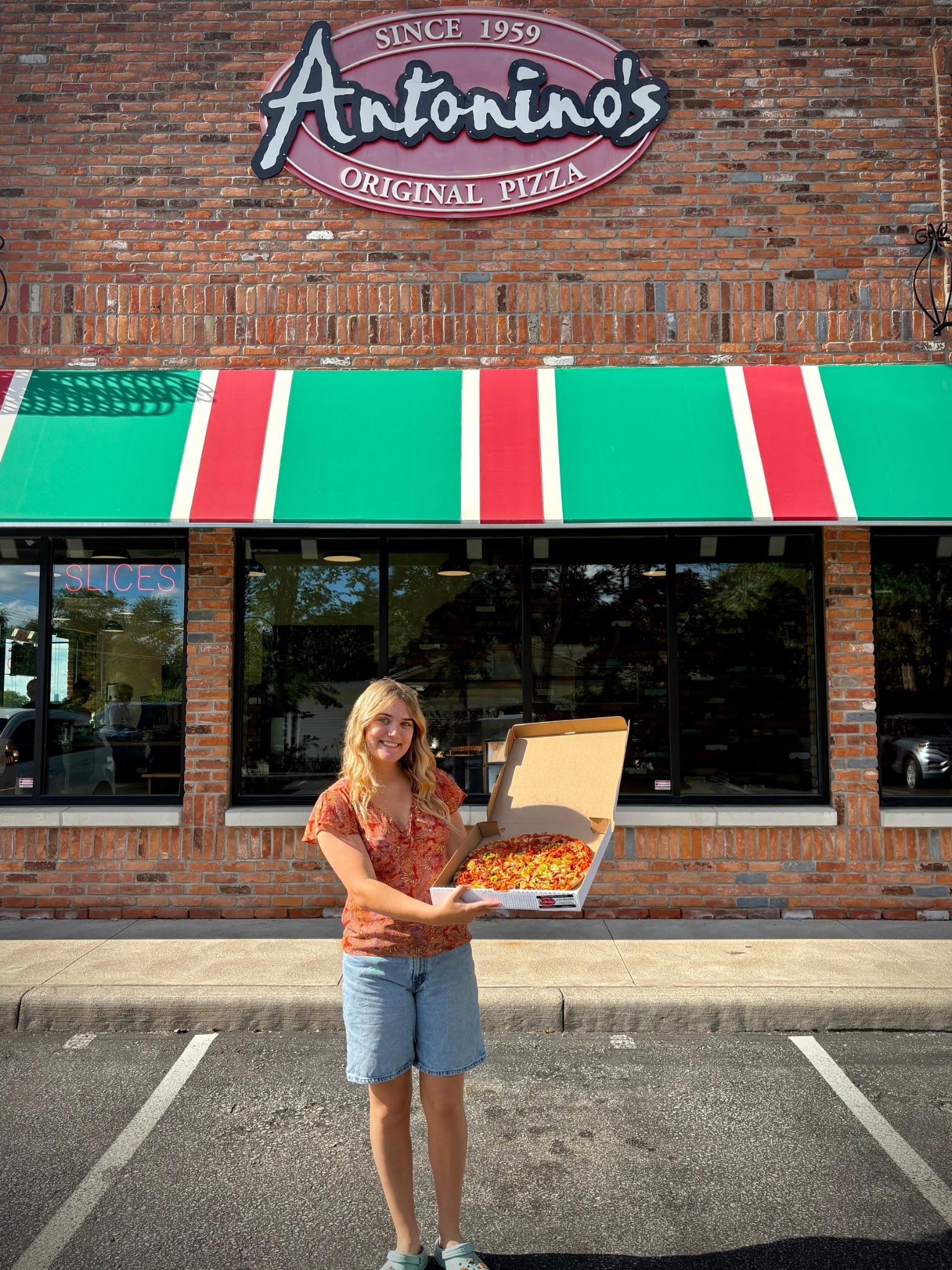 Ally Holding Pizza
class=