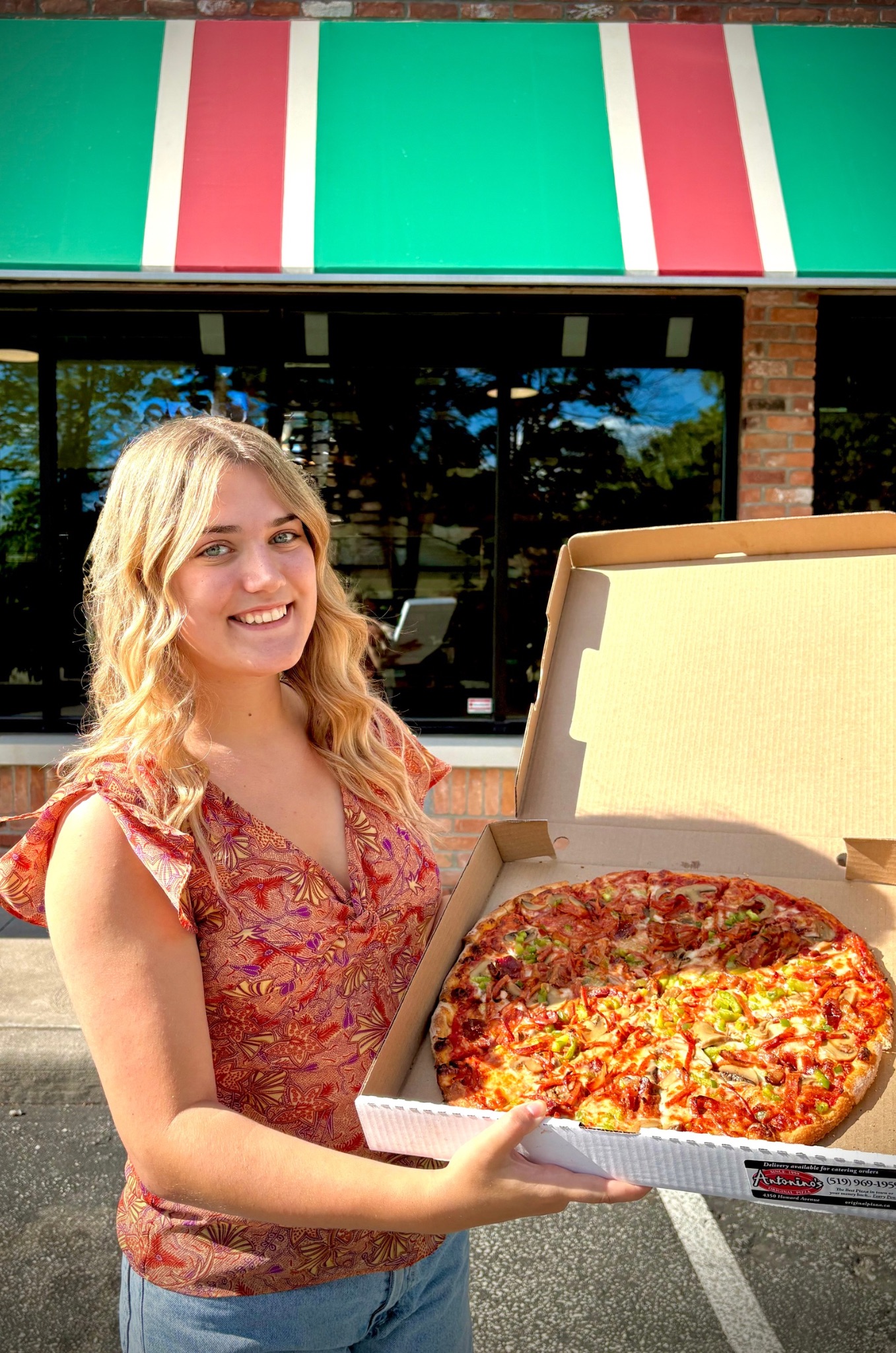 Ally Holding Pizza